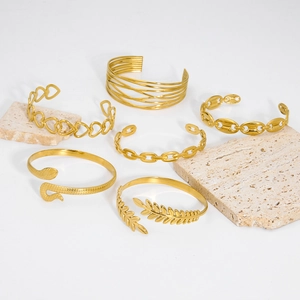 Six stylish gold-plated stainless steel cuff bracelets with diverse hollow heart and leaf designs