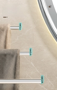 Close-up of swivel towel rack with non-slip end caps and polished metal finish