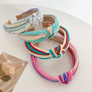 Stacked knot headbands in contrast colors like blue-white and pink-green satin fabric