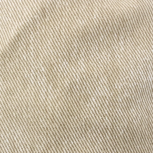 Close-up macro of durable beige twill denim fabric texture on a bucket hat