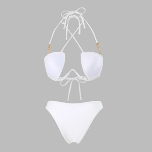 Close-up of white bikini top with halter neck ties and gold metal chain hardware