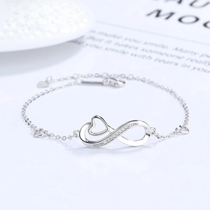 Macro shot of S925 sterling silver infinity heart pendant with sparkling crystals