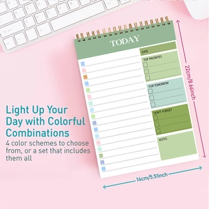 Detail view of Today spiral planner in sage green on office desk with size marks