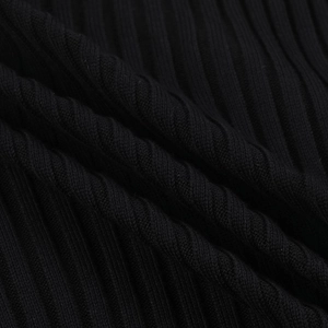 Detailed close-up of premium black ribbed knit fabric showing soft texture and thickness