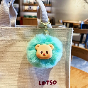 Cute mint green plush bear keychain on canvas bag with gold-tone spring hook clip
