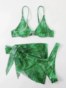 Detailed flat lay of green marble three-piece bikini set with ribbed texture and matching sarong