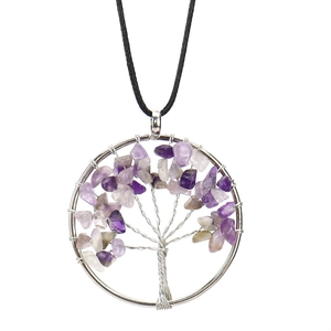 Detailed close-up of wire-wrapped tree of life pendant with purple crystal stones