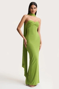 Close-up of grass green halter maxi dress with matching neck scarf and slim-fit cut