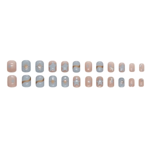 Short round blue and pink press-on nails with star patterns and sparkling rhinestone accents