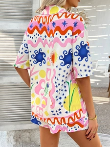 Back view of bohemian resort-style short set with abstract colorful sun and star prints