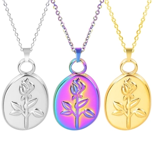 Detailed comparison of three rose relief pendants in silver, iridescent, and 18k gold finishes