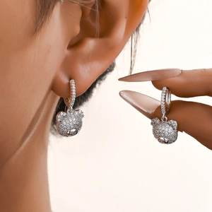 Sparkling crystal bear dangle earrings with gold plating and cubic zirconia inlay