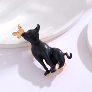 Cute black cat enamel brooch with golden bow and butterfly design in alloy finish