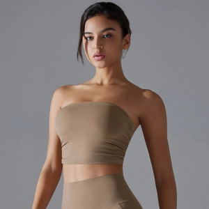 Detail of khaki bandeau yoga top with side pleats and high-waist matching leggings