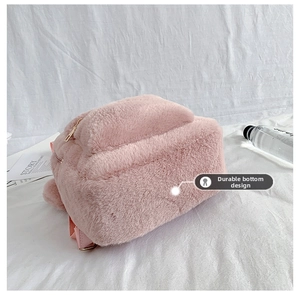 Detail view of the durable wear-resistant bottom design on this pink plush backpack