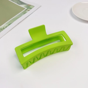 Detail view of large 13cm light green matte rectangle hair claw clip on white background