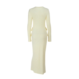 Detail of slim-fit knitted dress showing fine ribbed texture and ruffled hemline back view