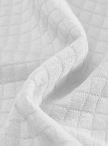 Gedetailleerde macro-opname van de witte wafelstructuur van de stof van de sweatshirt