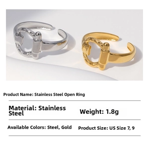 Detail view of steel and gold horsebit rings with weight and size specifications