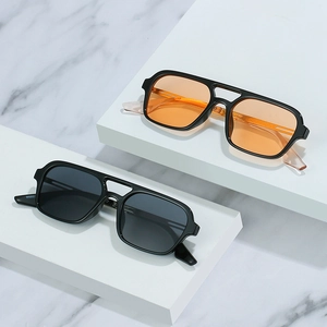 Classic square aviator sunglasses with double bridge and tinted lenses on display