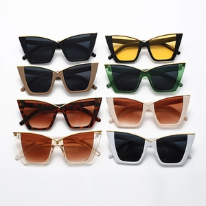Eight colors of wide cat eye sunglasses with gold metal top bar on white background