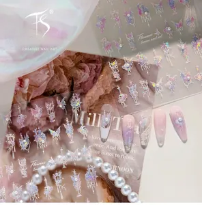 Macro detail of laser iridescent butterfly nail stickers with 3D floral and pearl design