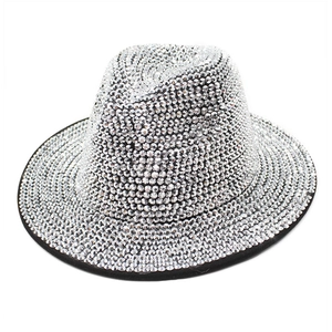 Close-up of silver rhinestones hand-set on a vintage black wool jazz fedora hat