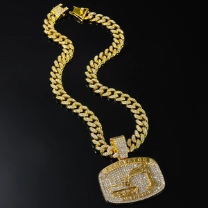 Iced out gold excavator operator pendant with matching Cuban link chain for hip hop style