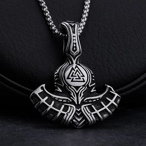 Viking axe necklace with Valknut symbol in antique silver on dark background