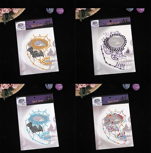 Detailed view of Halloween face gems featuring colorful spider webs and skull designs