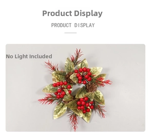 Detailed top view of Christmas candle ring with golden leaves, red berries and pine cones