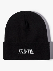 Close-up of white mimi letter embroidery on black ribbed knit beanie for winter