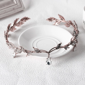Detail of rose gold leaf bridal tiara with sparkling crystals and drop pendant