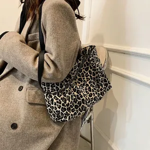 Stylish large leopard print canvas tote bag with black leather straps for women