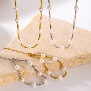 Titanium steel necklace and bracelet set with pearls and beads in gold and silver finish