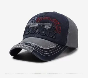 Detail of vintage washed baseball cap with New York embroidery and distressed brim texture