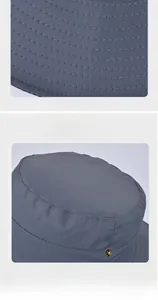 Detail view of reinforced stitching on brim and metal eyelets of blue outdoor sun hat