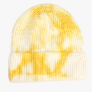 Close-up detail of yellow and white tie-dye ribbed knit beanie with folded cuff design