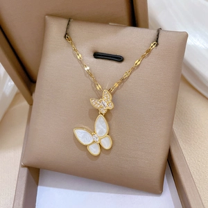 Gold titanium necklace with white mother of pearl and zircon butterfly pendants