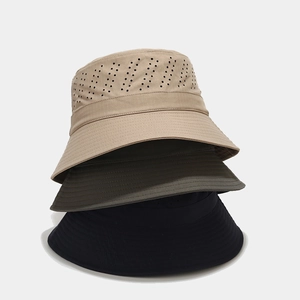 Detailed view of laser-cut ventilation holes and stitching on multi-color outdoor hats