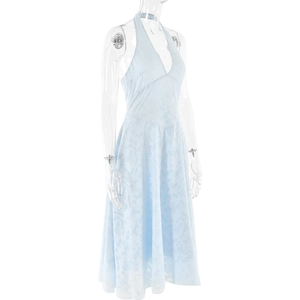 Detail of light blue lace fabric with intricate floral patterns on a halter dress