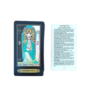 Detailed tarot deck guidebook and The High Priestess card with mystical blue illustrations