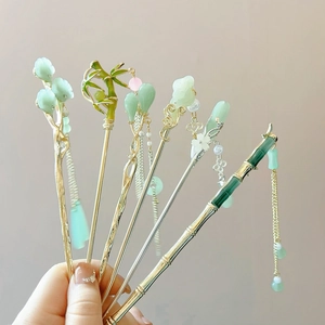 Traditional Chinese green hair sticks with bamboo motifs and tassels for women