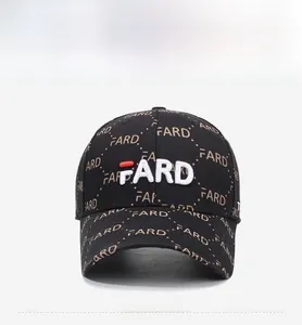 Detailed view of 3D letter embroidery and printed pattern on black cotton baseball cap