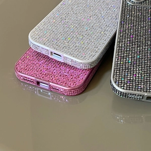 Close-up of sparkling glitter phone case showing precision port cutouts and lens protection