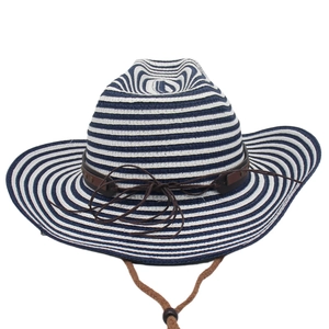 Detail of nautical navy striped straw hat with leather band and adjustable chin cord
