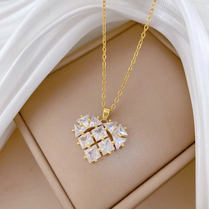 Luxurious hollow heart pendant necklace with shimmering crystals on a gold titanium steel chain
