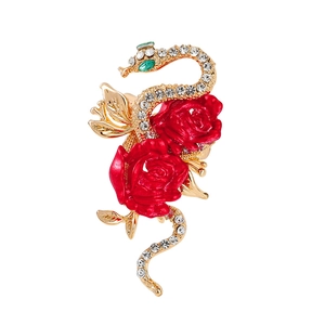 Elegant gold snake brooch with red roses and sparkling crystals for New Year gift