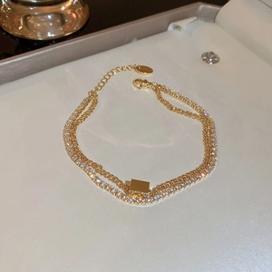 Double-layered gold tennis bracelet with zircon accents and geometric rectangle pendant