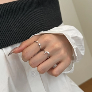 Detail of adjustable S925 sterling silver star and moon rings with zircon accents